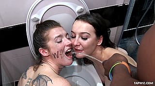 Piss Slut: Two Naked Women Pissing in a Bathroom
